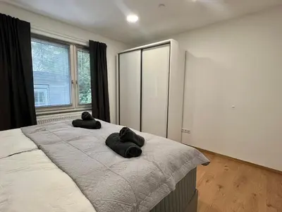 Ein Bett oder Betten in einem Zimmer der Unterkunft RUEHOME