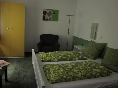 Ein Bett oder Betten in einem Zimmer der Unterkunft Schultenhof
