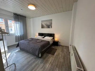 Ein Bett oder Betten in einem Zimmer der Unterkunft schön wohnen ! Netflix Nespresso Küche Parkplatz Garten