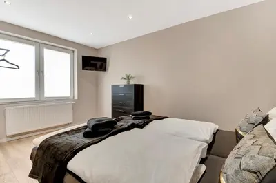 Ein Bett oder Betten in einem Zimmer der Unterkunft 24-7 Living - Unna Central City Apartments
