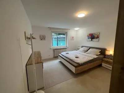 Ein Bett oder Betten in einem Zimmer der Unterkunft Haus mit Wintergarten und Kamin