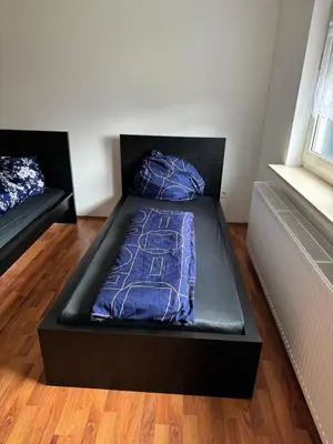 Ein Bett oder Betten in einem Zimmer der Unterkunft Schöne EG Wohnung mit TV, Wlan und Küche - Maria