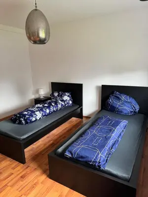 Ein Bett oder Betten in einem Zimmer der Unterkunft Schöne EG Wohnung mit TV, Wlan und Küche - Maria