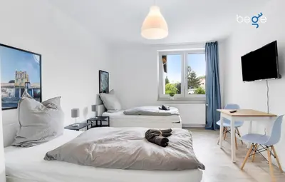 Ein Bett oder Betten in einem Zimmer der Unterkunft BEGE APARTMENTS WorkAway Residence
