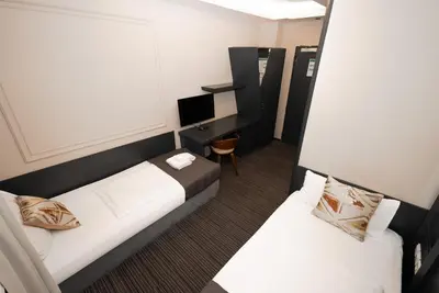 Ein Bett oder Betten in einem Zimmer der Unterkunft Adrett Hotel Königsallee