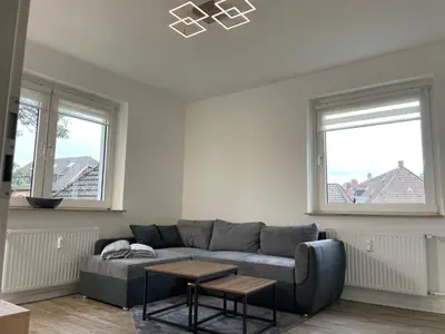 Ein Sitzbereich in der Unterkunft City Apartment 1#Netflix &Wlan &Kingsize Bett &Kaffee Maschine & Zentral & 500m Innenhafen & 2 min U Bahn