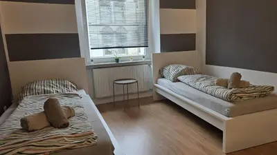 Ein Bett oder Betten in einem Zimmer der Unterkunft HagenStay Delstern 1
