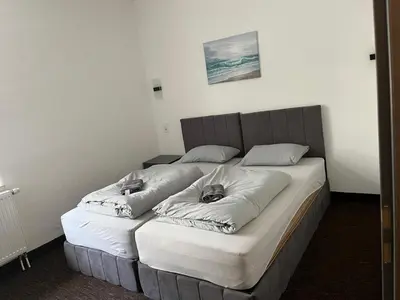 Ein Bett oder Betten in einem Zimmer der Unterkunft Duisburger Hostel