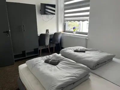 Ein Bett oder Betten in einem Zimmer der Unterkunft Duisburger Hostel