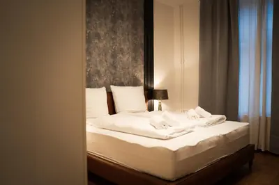 Ein Bett oder Betten in einem Zimmer der Unterkunft Junik Apartments - Ferienwohnungen in Duisburg