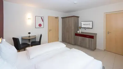 Ein Bett oder Betten in einem Zimmer der Unterkunft ERSTAY