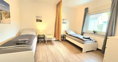 Ein Bett oder Betten in einem Zimmer der Unterkunft Modern 4-Room Apartment with Balcony & Free Parking & Free Wi-Fi - KA02