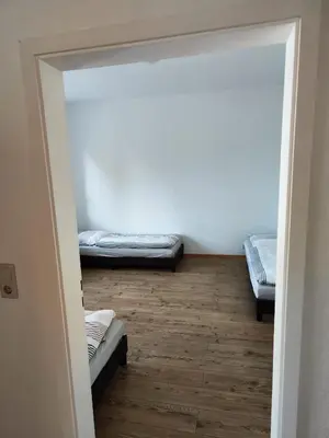 Ein Bett oder Betten in einem Zimmer der Unterkunft Monteurwohnung Haus Elbert 4