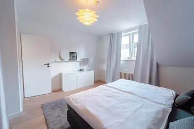 Ein Bett oder Betten in einem Zimmer der Unterkunft Zentral gelegene Ferienwohnung Solingen - Ohligs