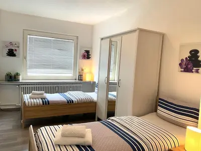 Ein Bett oder Betten in einem Zimmer der Unterkunft Helle, großzügige Wohnung für bis zu 6 Personen