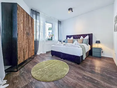 Ein Bett oder Betten in einem Zimmer der Unterkunft Alpha Apartments