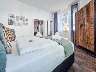Ein Bett oder Betten in einem Zimmer der Unterkunft Alpha Apartments