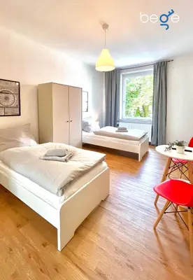 Ein Bett oder Betten in einem Zimmer der Unterkunft BEGE APARTMENTS Coporate Haven