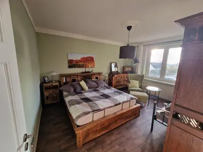 Ein Bett oder Betten in einem Zimmer der Unterkunft FeWo Brückenblick