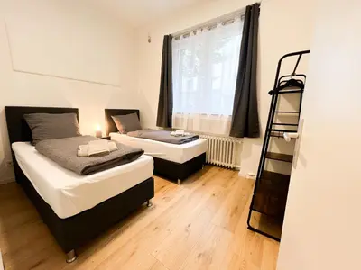 Ein Bett oder Betten in einem Zimmer der Unterkunft Vibehome Düsseldorf - Little Tokyo