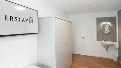 Ein Badezimmer in der Unterkunft ERSTAY - moderne Zimmer