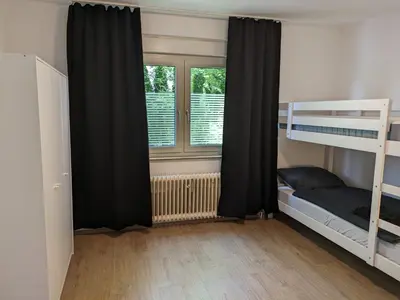 Ein Bett oder Betten in einem Zimmer der Unterkunft interaktiv Appartements in Heiligenhaus - Herzogstrasse