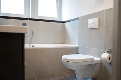 Ein Badezimmer in der Unterkunft JUNIK Apartments Oberhausen No º11