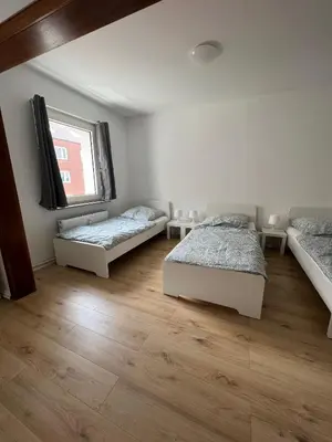 Ein Bett oder Betten in einem Zimmer der Unterkunft RENT SOLUTION - Apartments in Herne - bis zu 10 Personen