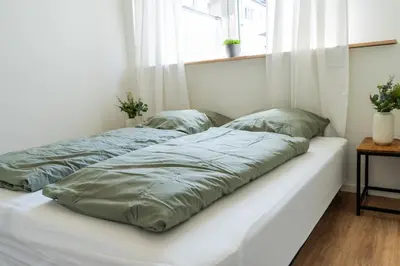 Ein Bett oder Betten in einem Zimmer der Unterkunft City Apartments Old Town Düsseldorf