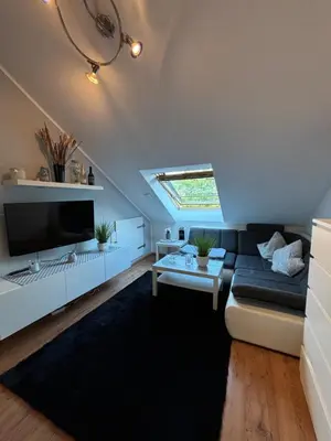 Ein Sitzbereich in der Unterkunft Privatunterkunft Am Aaper Wald