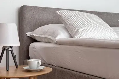 Ein Bett oder Betten in einem Zimmer der Unterkunft Moderne Wohnung in Stadionnähe mit Parkplatz