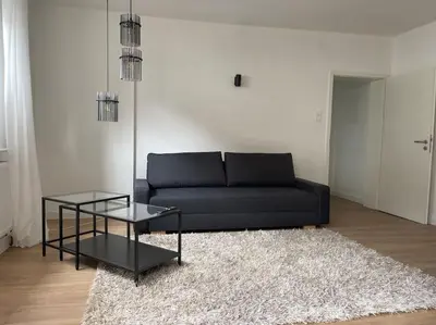 Ein Sitzbereich in der Unterkunft Moderne Wohnung in Stadionnähe mit Parkplatz