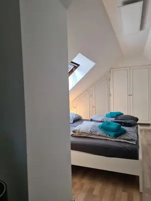 Ein Bett oder Betten in einem Zimmer der Unterkunft Wohnung Haldenblick für max 9 Personen