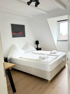 Ein Bett oder Betten in einem Zimmer der Unterkunft JayBnB - Loft über den Dächern von Dortmund