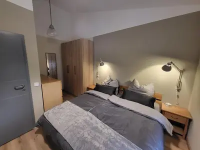 Ein Bett oder Betten in einem Zimmer der Unterkunft Ferienwohnung am Rathenauplatz