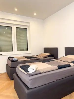 Ein Bett oder Betten in einem Zimmer der Unterkunft Ruhr Business Apartments Essen Apartment mit 5 Einzelbetten Privat Parkplatz