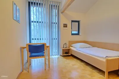 Ein Bett oder Betten in einem Zimmer der Unterkunft Willi-Michels-Bildungsstätte
