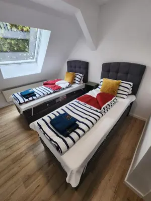Ein Bett oder Betten in einem Zimmer der Unterkunft City Apart