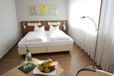 Ein Bett oder Betten in einem Zimmer der Unterkunft Landhotel Mutter Althoff