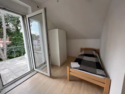 Ein Bett oder Betten in einem Zimmer der Unterkunft ES-Unterkunft