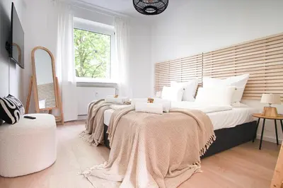 Ein Bett oder Betten in einem Zimmer der Unterkunft HOMEFY - Balcony Apartment