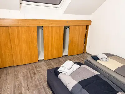 Ein Bett oder Betten in einem Zimmer der Unterkunft Ruhr Business Apartments Essen Apartment mit 7 Einzelbetten Privat