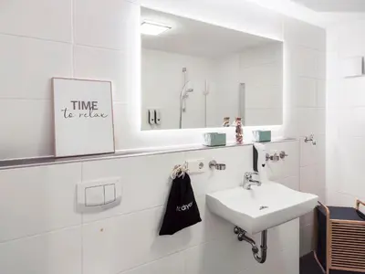 Ein Badezimmer in der Unterkunft Maracoon - Design-Apartments mit Küche, Garten, Self-Checkin