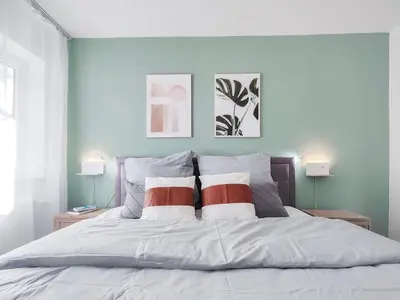 Ein Bett oder Betten in einem Zimmer der Unterkunft Maracoon - Design-Apartments mit Küche, Garten, Self-Checkin