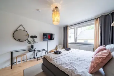 Ein Bett oder Betten in einem Zimmer der Unterkunft Boho Bliss 2R Apartment Zentral