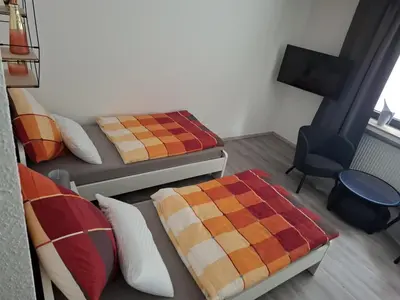 Ein Bett oder Betten in einem Zimmer der Unterkunft Ferienwohnung Unterrath