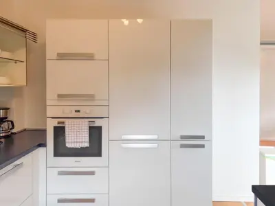 Küche/Küchenzeile in der Unterkunft T&K Apartments - Mettmann - Schöne 5 Zimmer Maisonette - 20min Messe Fair DUS
