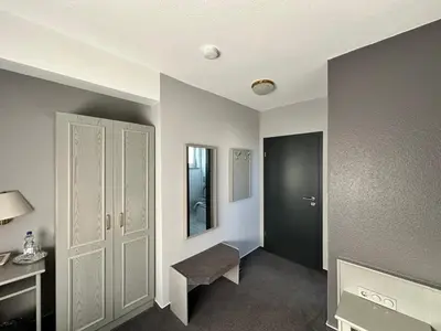 Ein Bett oder Betten in einem Zimmer der Unterkunft M&M Park Hotel