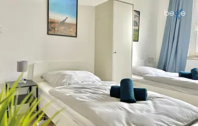 Ein Bett oder Betten in einem Zimmer der Unterkunft BEGE APARTMENTS WorkStay Lodge