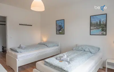 Ein Bett oder Betten in einem Zimmer der Unterkunft BEGE APARTMENTS Corporate Lodge
